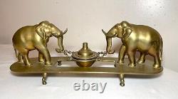 Antique 1800's polished solid heavy brass double elephant holding oil lamp stand