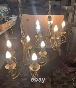 Pair of antique brass chandeliers