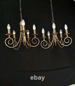 Pair of antique brass chandeliers