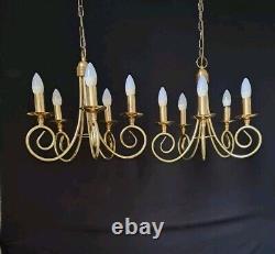 Pair of antique brass chandeliers