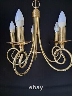 Pair of antique brass chandeliers