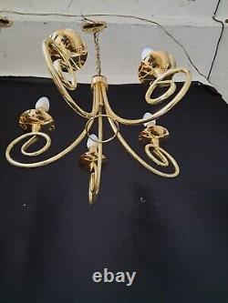 Pair of antique brass chandeliers