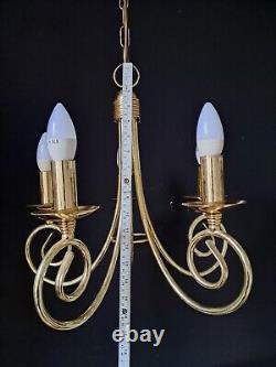 Pair of antique brass chandeliers