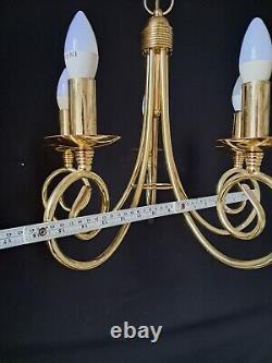 Pair of antique brass chandeliers